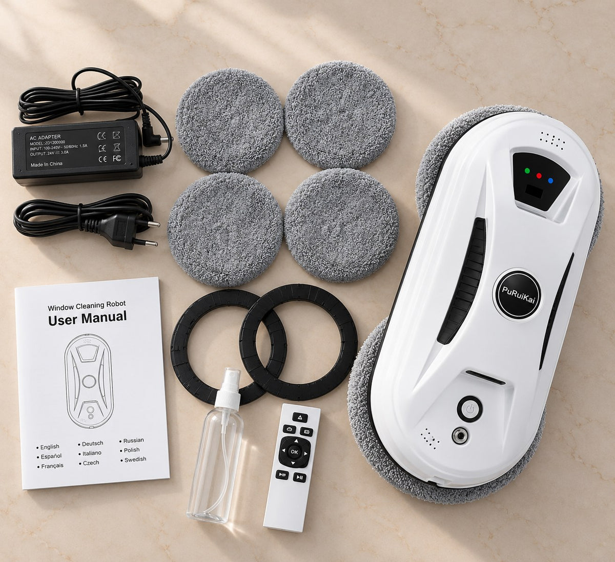 Contenu du colis du Setoriva Essentiel : robot, lingettes microfibre de rechange, anneaux de fixation, flacon pulvérisateur, télécommande, adaptateur et cordon, notice Image